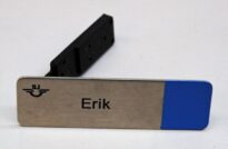 En SJ-namnbricka med namnet 'Erik' på
